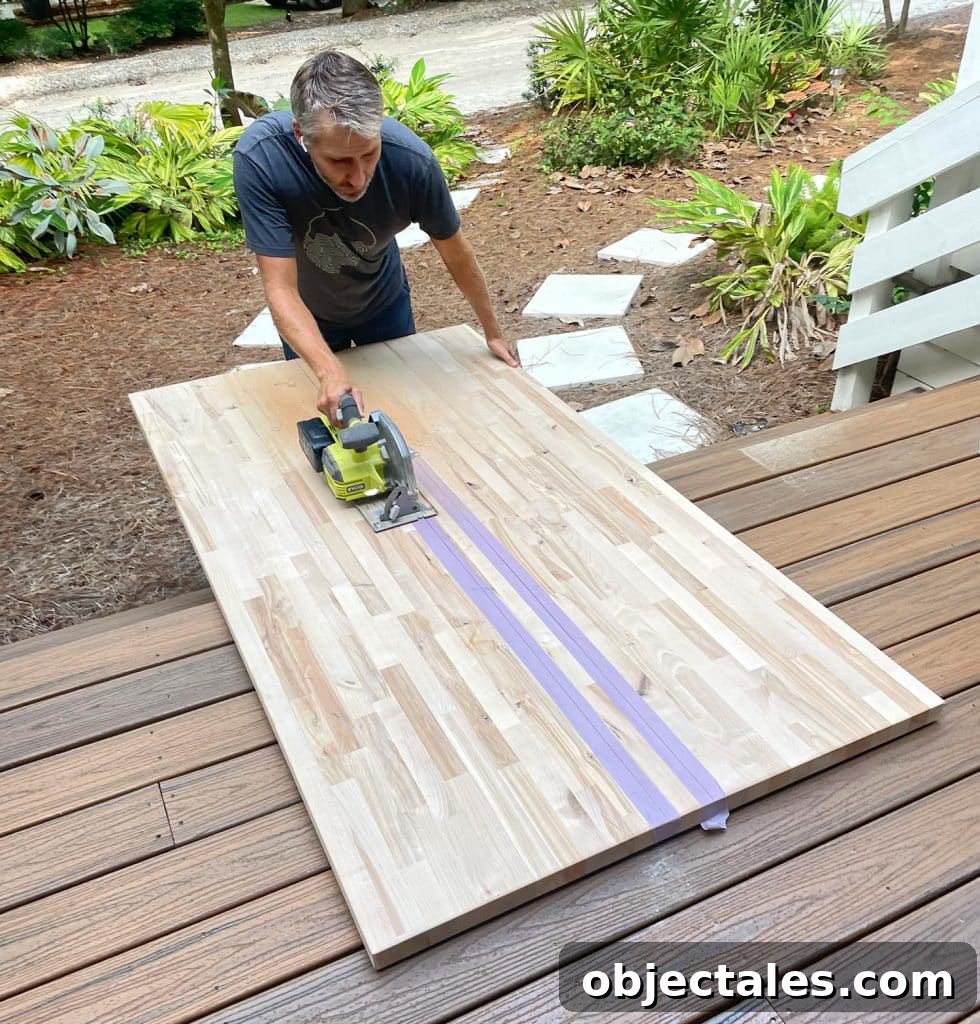 John Cutting Butcher Block Island Counter Top In Half With Circular Saw