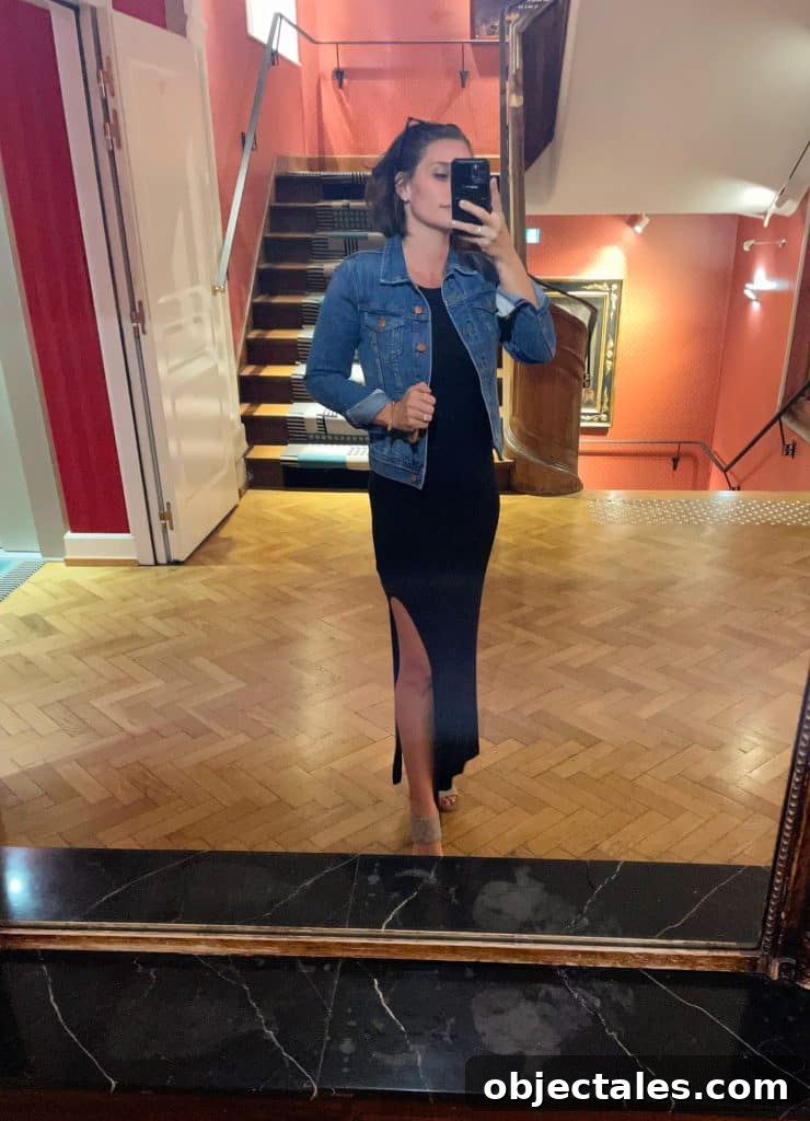 Sherry selfie in hotel mirror with long black dress and sandals