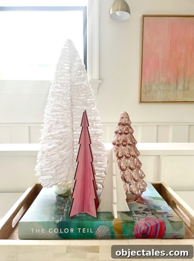 Assortment of decorative Christmas tabletop trees in pink and white