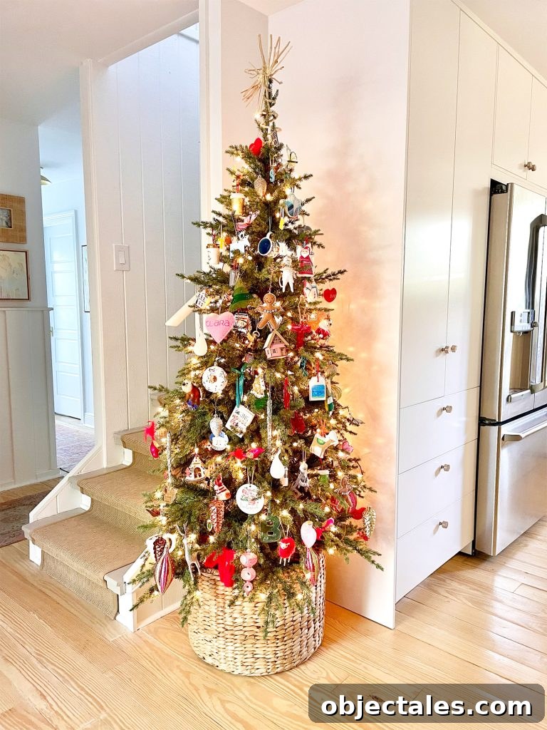 Narrow Christmas Tree in corner of kitchen next to pantry and stairs