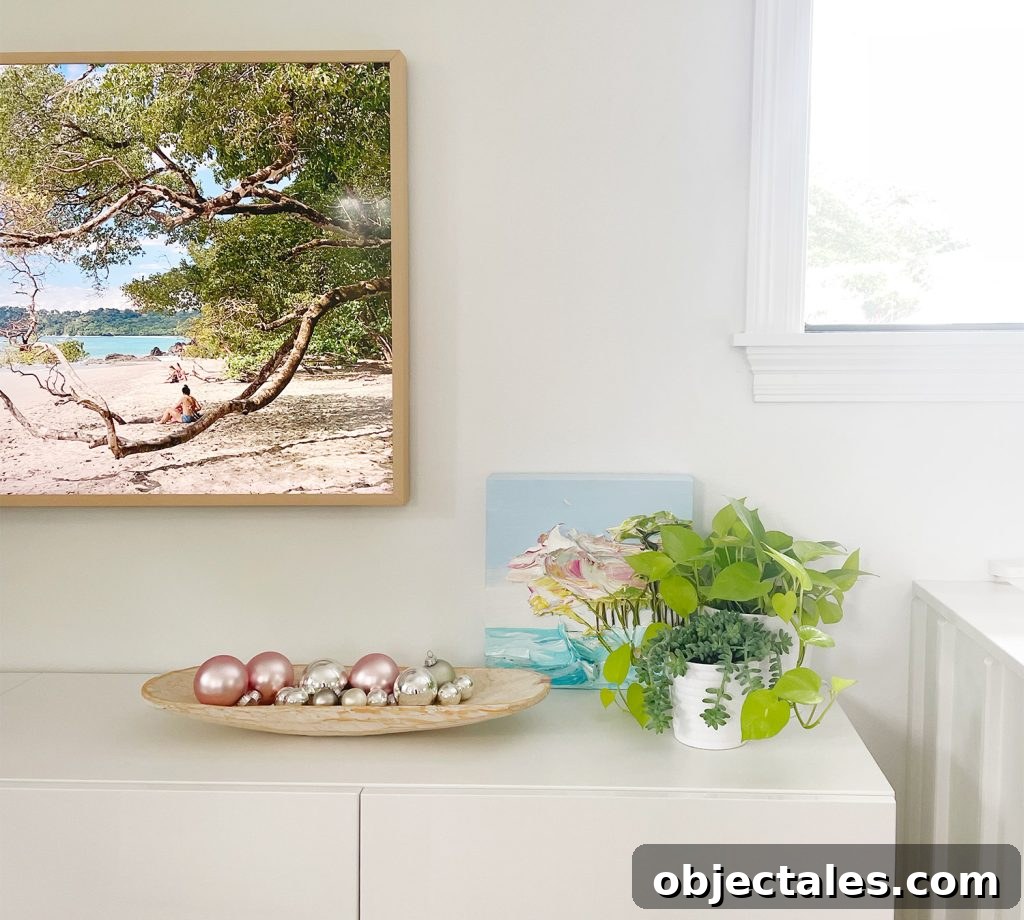 Shallow dish of ornaments as tabletop decor on media console