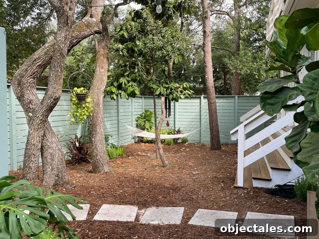 Add Outdoor Storage: Smart Shed, Cabinet, and Deck Ideas 14 Full View Of Side Yard With Hammock Hanging Among Trees