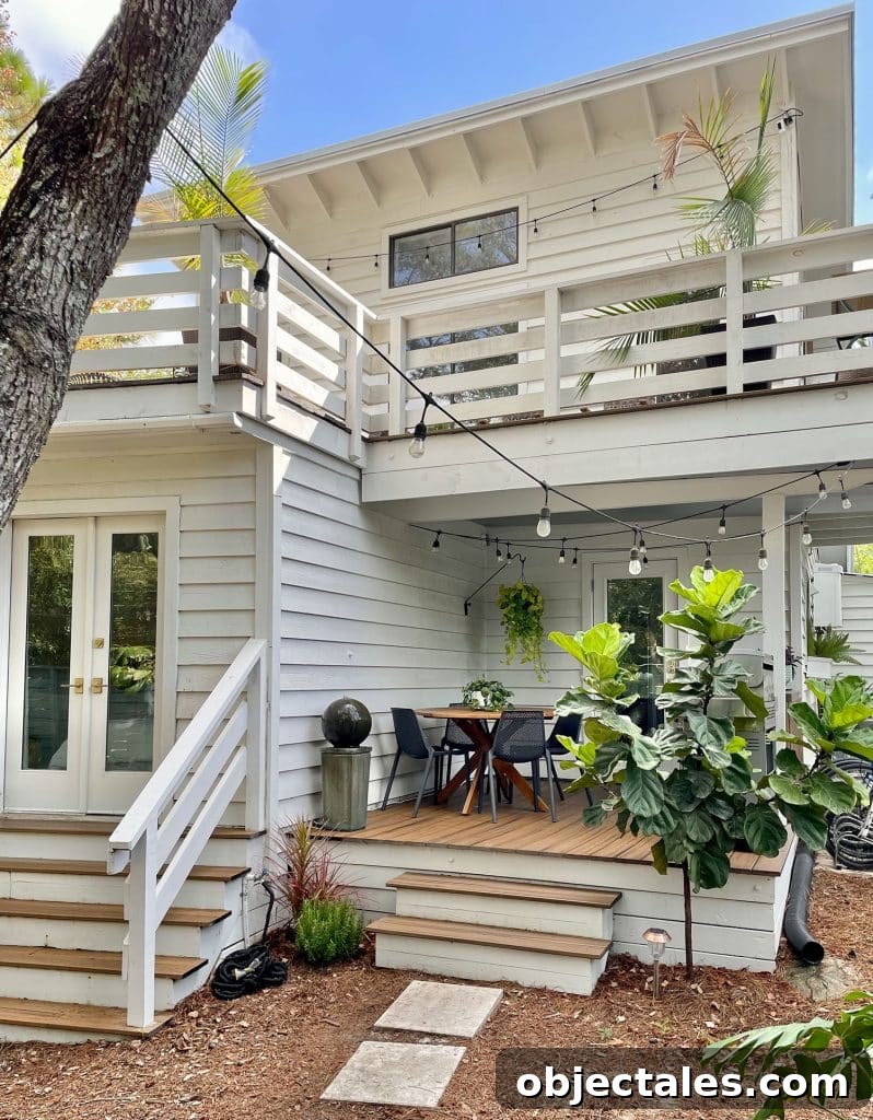 Add Outdoor Storage: Smart Shed, Cabinet, and Deck Ideas 5 Full View of House With Kitchen Porch On First Floor With Plants And String Lights