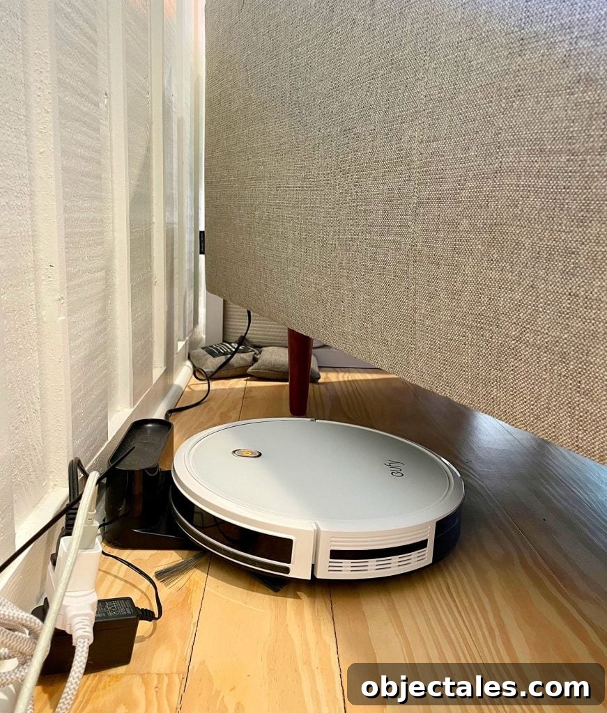 Eufy RoboVac 11S Charging At Base Station Plugged In Under Couch