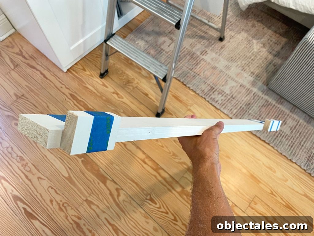 Backer Piece Of Scrap Wood With Blocks Taped To Front For Precise Placement