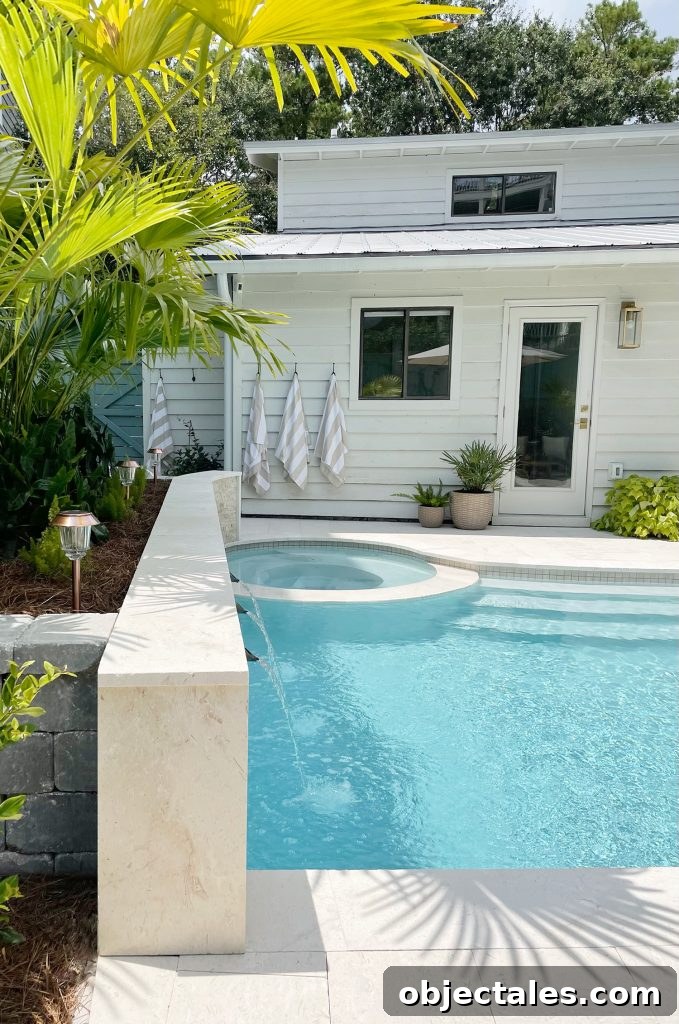 Backyard pool with round hot tub in small home backyard