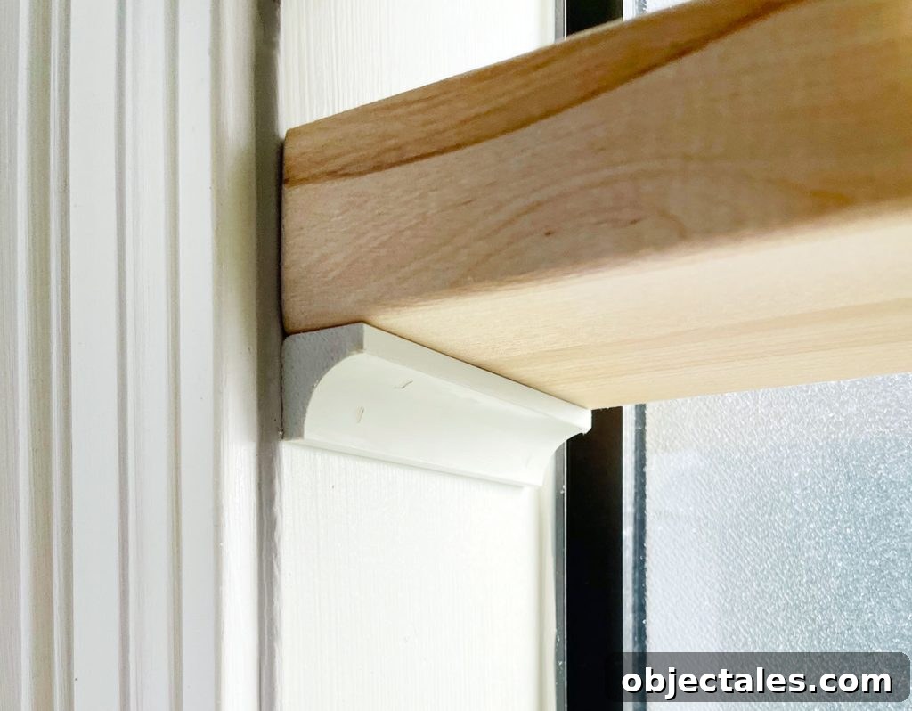 DIY Window Plant Shelf: Step-by-Step Tutorial 11 Close Up Of Butcher Block Shelf Propped Up On Cove Molding In Bathroom Window