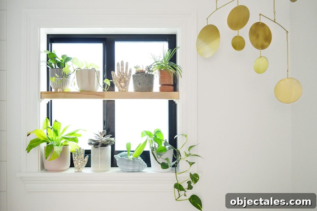 DIY Window Plant Shelf: Step-by-Step Tutorial 4 Window plant shelf with gold mobile in bathroom