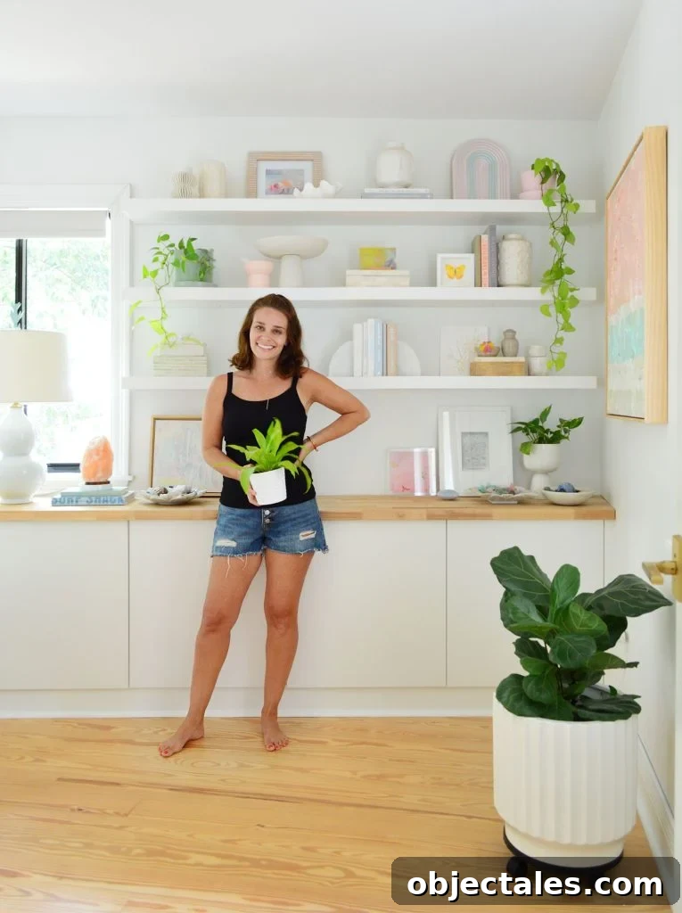 How We Installed IKEA Floating Shelves in Our Bedroom 2 Sherry Standing With Plant In Front Of Ikea Lack Floating Shelves