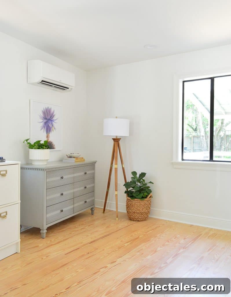 Before photo of bedroom corner with random dressers in corner