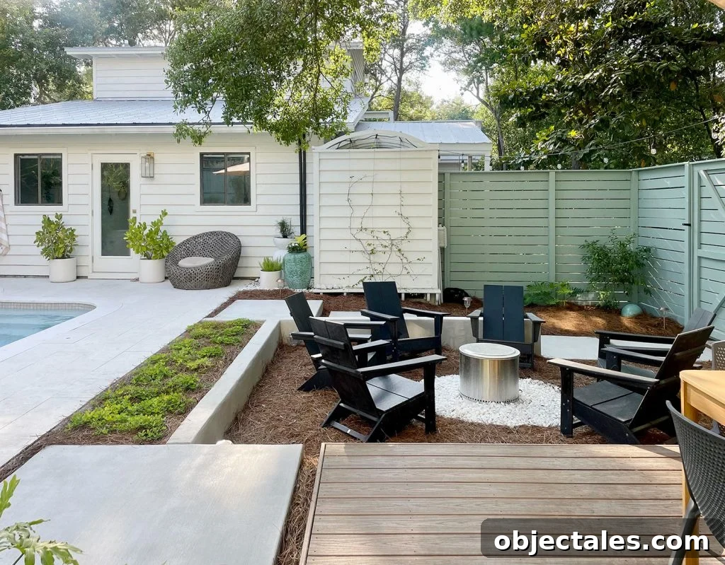 Sunken firepit area in larger backyard next to pool