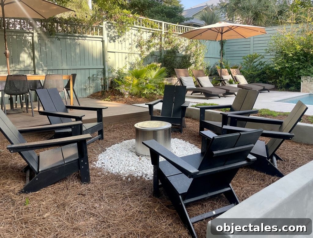 Solo Stove firepit area with black Adirondack Chairs