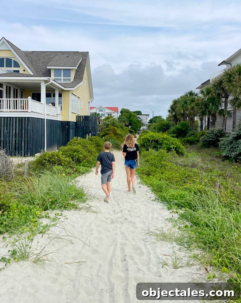 Children Walking Down Beach Access At Isle Of Palms South Carolina