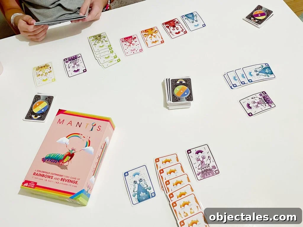 Mantis Colorful Card Game Being Played On Table