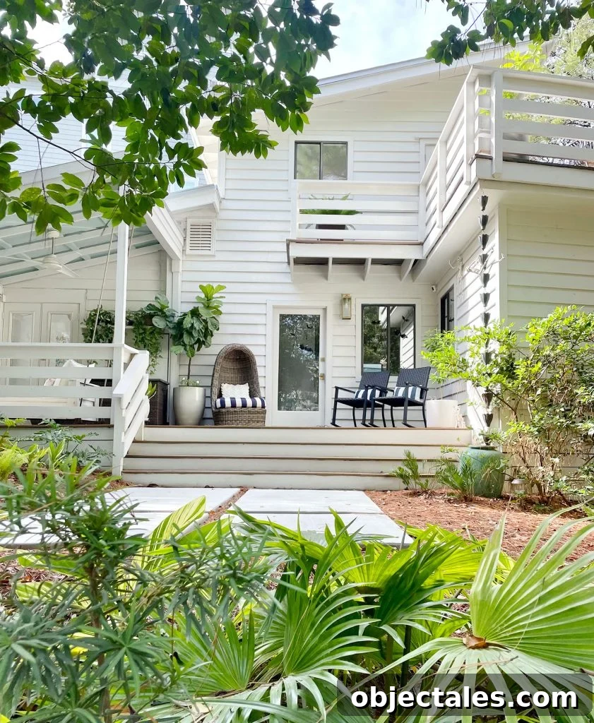 Exterior Of White Modern Home With Siding And Florida Landscaping
