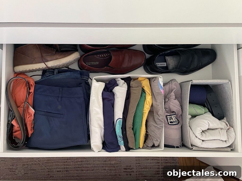 IKEA PAX Closet Organization: How We Transformed Our Space 15 Ikea Pax Wardrobe Closet Overhead Of Open Drawer With Mens Clothes Shoes
