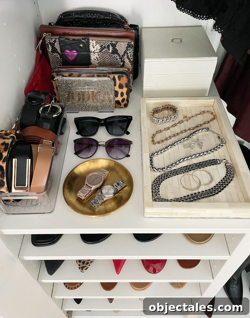 IKEA PAX Closet Organization: How We Transformed Our Space 7 Ikea Pax Wardrobe Closet Overhead of Shelf With Jewelry And Clutches