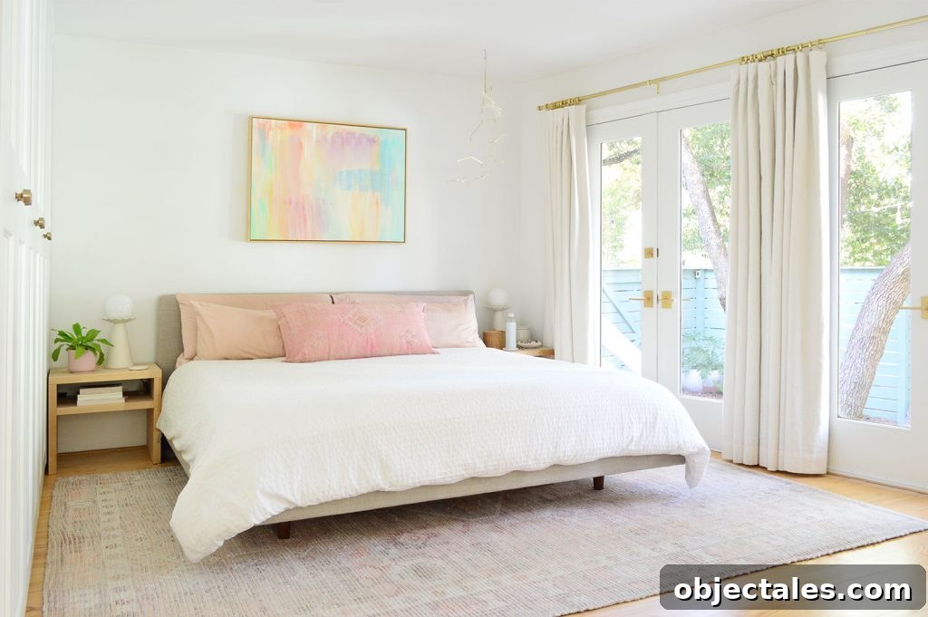 6 Bedroom Upgrades That Transformed Our Space 9 Bright Beachy Bedroom With Colorful Painting And French Door Overlooking Yard