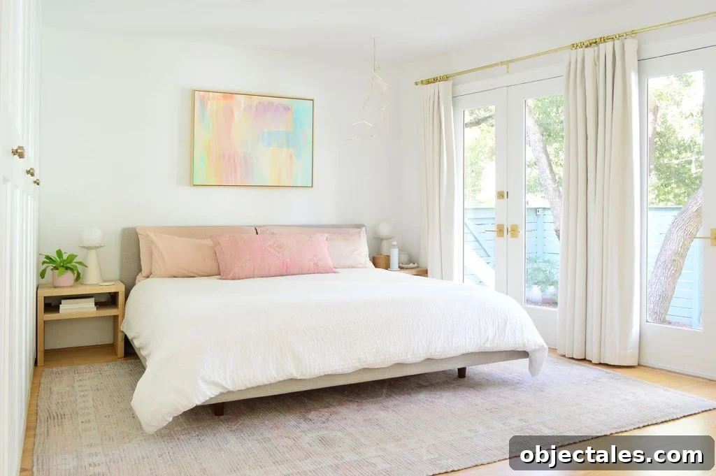 6 Bedroom Upgrades That Transformed Our Space 19 Bright Beachy Bedroom With Colorful Painting And French Door Overlooking Yard