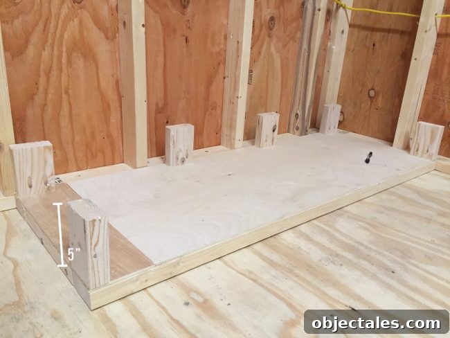 Adding small 5 inch posts to bottom of scrap wood storage organizer