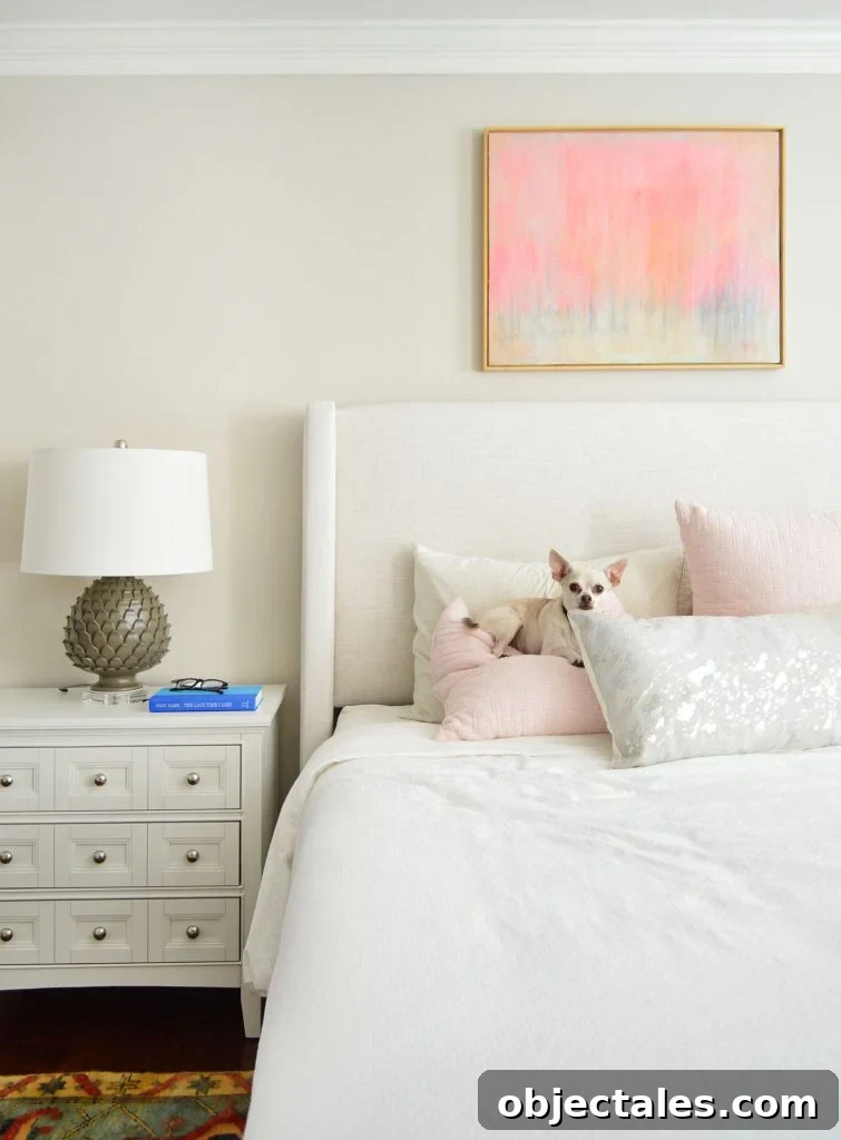 Benjamin Moore Edgecomb Gray: A Versatile Greige for Any Room 13 Detail of Upholstered Headboard With Edgecomb Gray Walls and Chihuahua