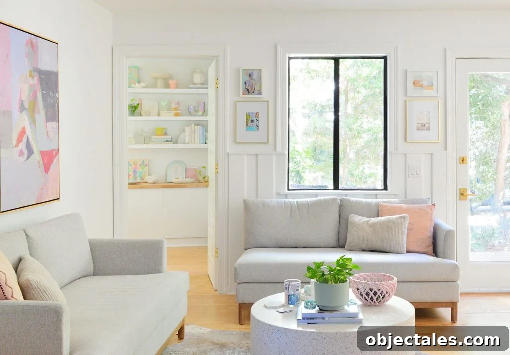 Close Up View Of Sitting Area With Gray Loveseats And Pure White Walls