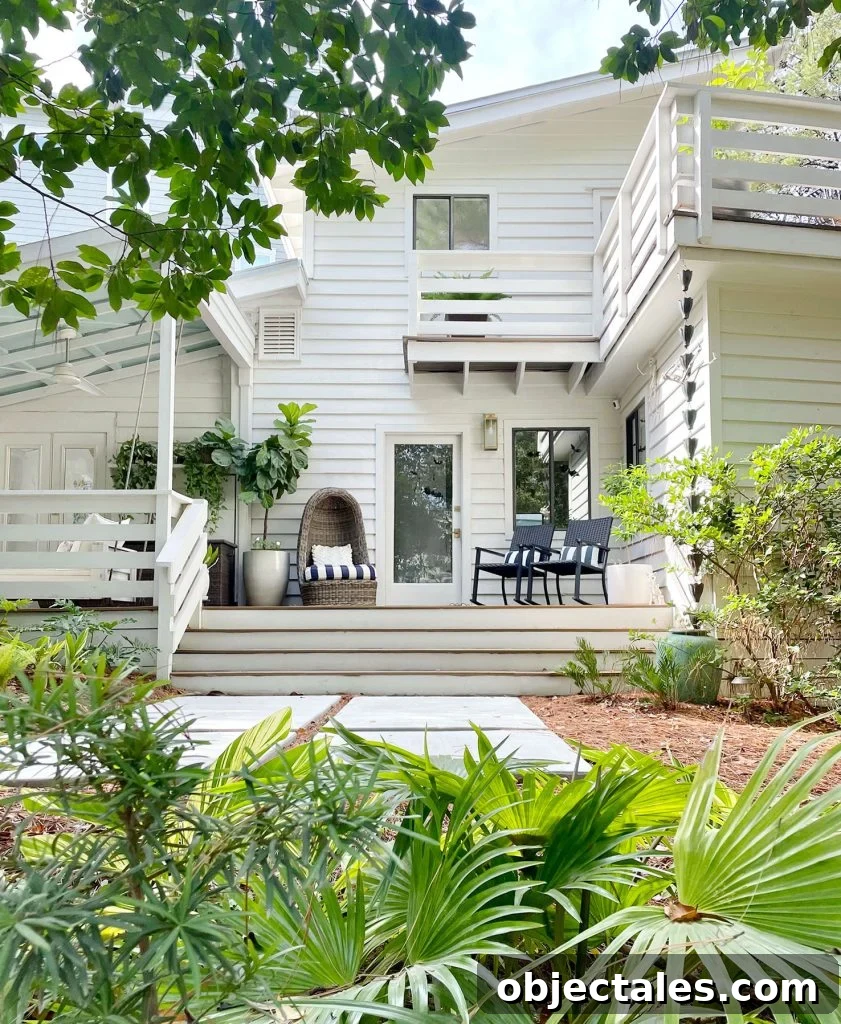 Exterior Of White Modern Home With Siding And Florida Landscaping
