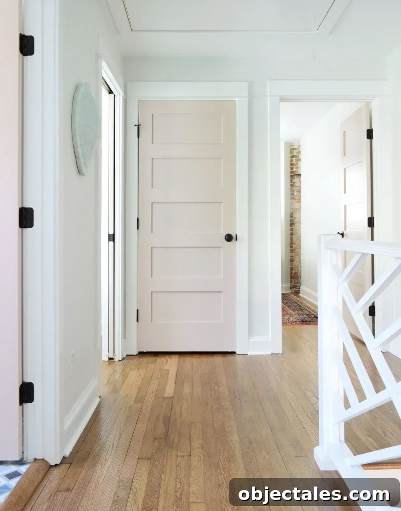 Hallway Upstairs Landing With Pink Doors And Extra White Trim