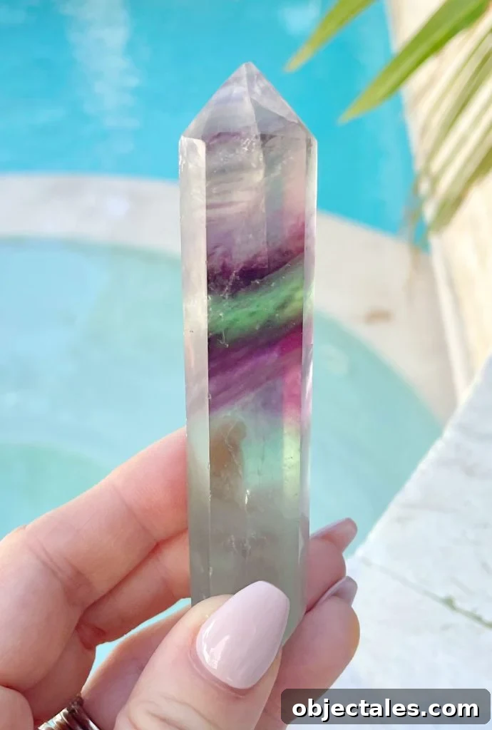 Rainbow Fluorite Crystal Point In Hand By Pool
