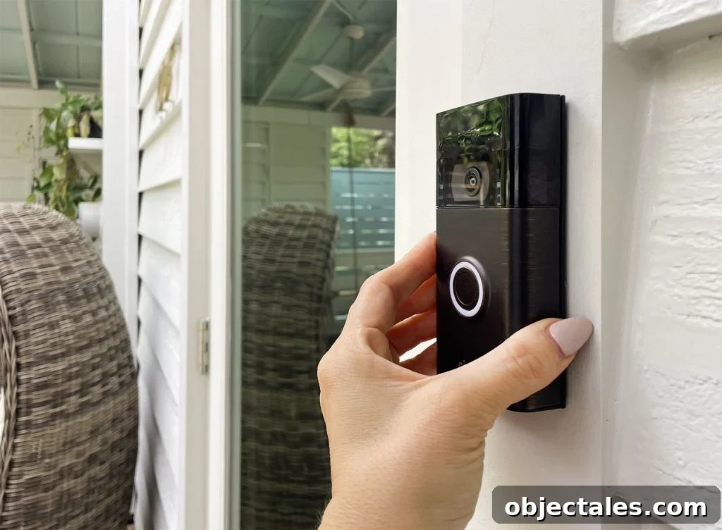 Ring Doorbell Installation: 5-Step Guide 11 Hand Placing Ring Video Doorbell Onto Mount