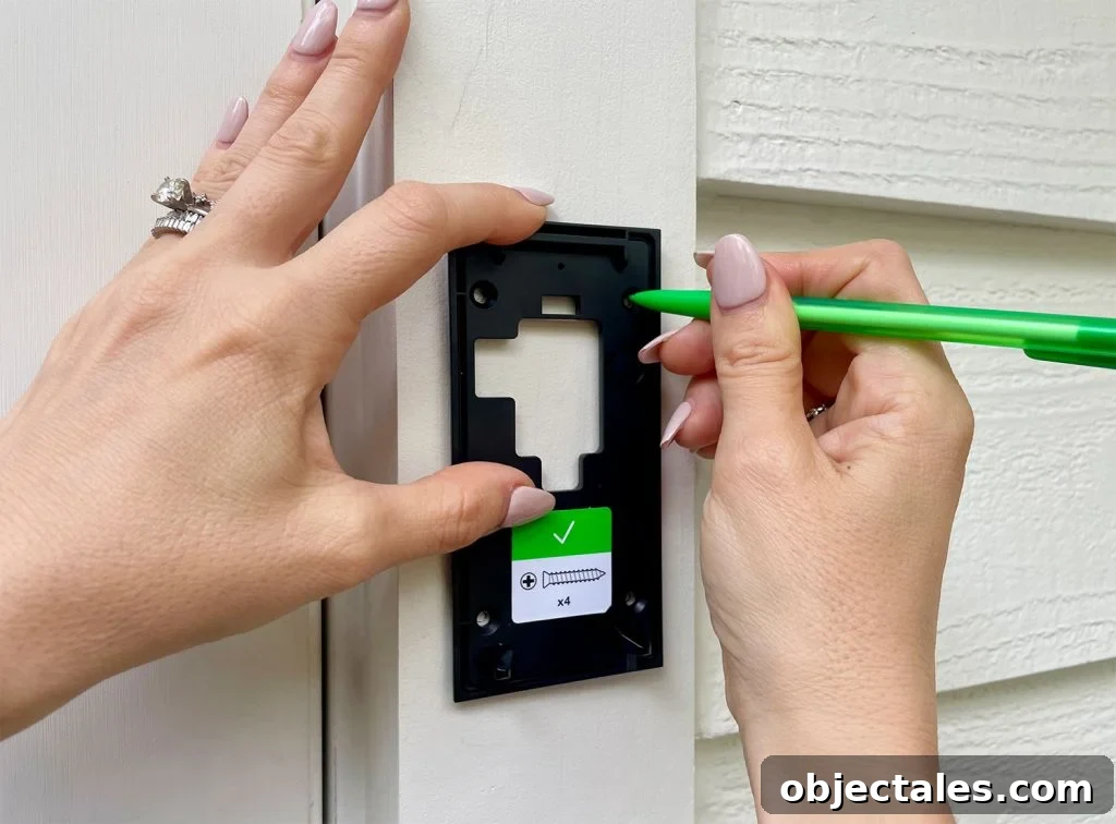 Ring Doorbell Installation: 5-Step Guide 8 Using Pencil to Mark Holes On Ring Doorbell Mounting Plate