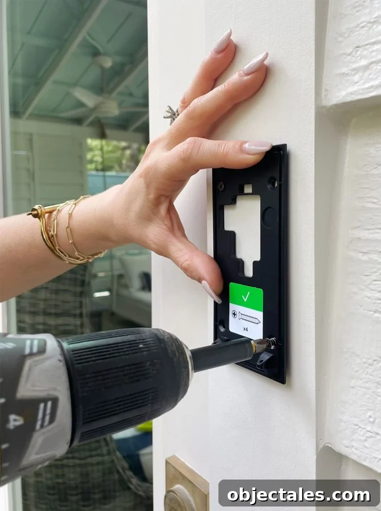 Ring Doorbell Installation: 5-Step Guide 10 Screwing Ring Doorbell Mounting Plate To Front Door Frame