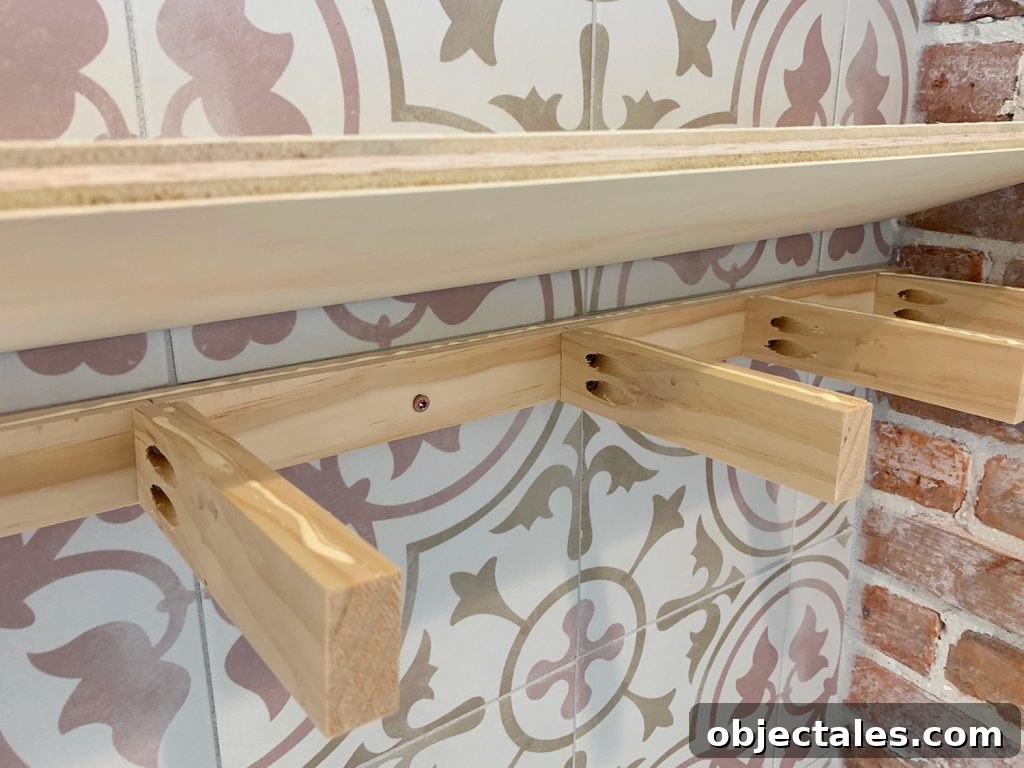 How to Build Floating Kitchen Shelves 5 Plywood Top Being Lowered Onto Wooden Support Bracket For DIY Floating Shelves