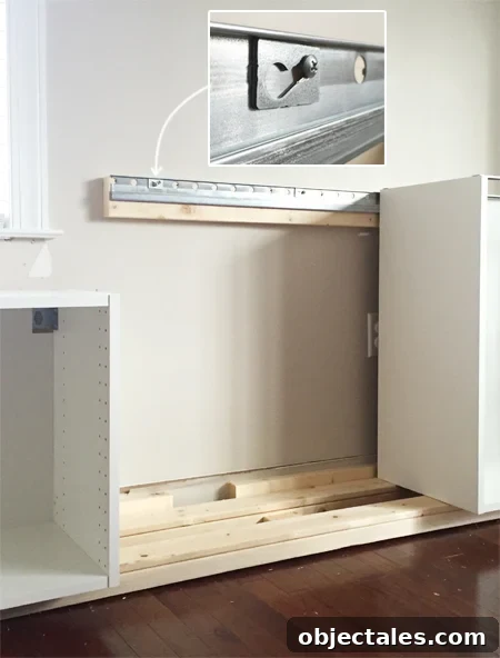 How to Build Custom Built-In Cabinets: Step-by-Step 6 detail of how Ikea Sektion cabinets attach to metal wall rail using screw and washer