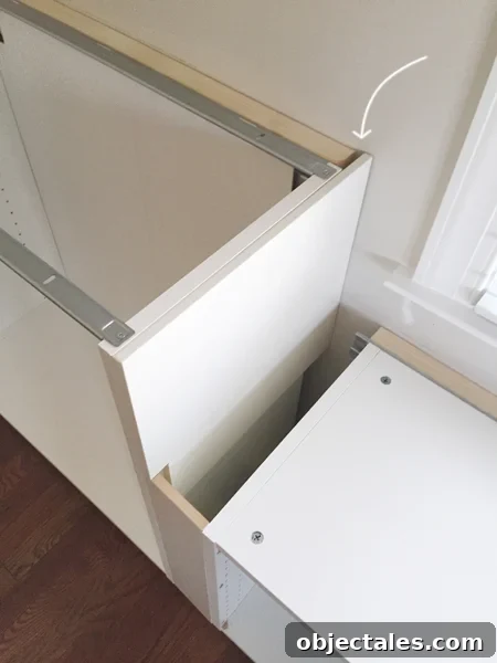 How to Build Custom Built-In Cabinets: Step-by-Step 8 white cabinet filler pieces used to cover exposed side of Ikea cabinet installation