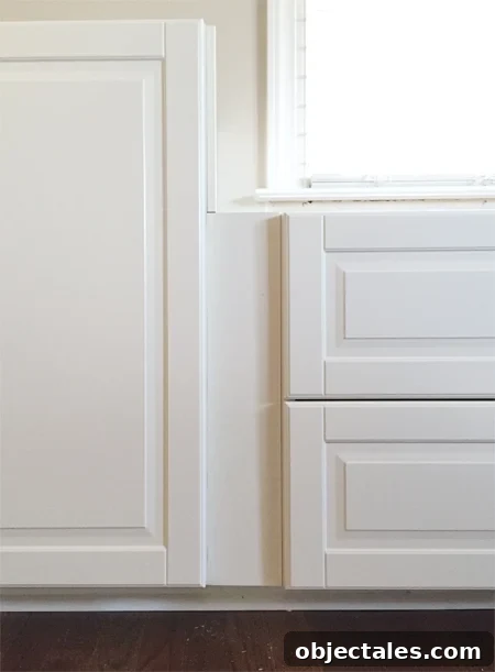 How to Build Custom Built-In Cabinets: Step-by-Step 9 filler piece between two white Ikea Sektion cabinets with Bodbyn doors creating recessed spot between doors and drawers