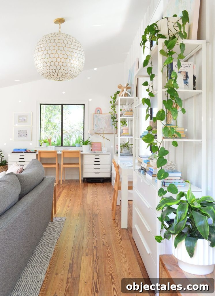 Upstairs family room with plants and Serena & Lily capiz pendant light