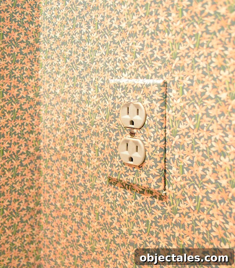 How to Remove Wallpaper Without Damaging Walls 7 Wall outlet cover with floral wallpaper