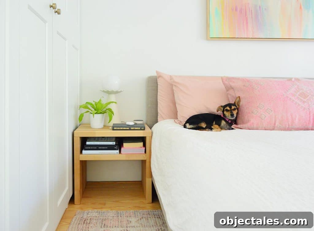 Wood Butcher Block Nightstand Next To Bed With Penny The Chorkie Sleeping On Pink PIllow