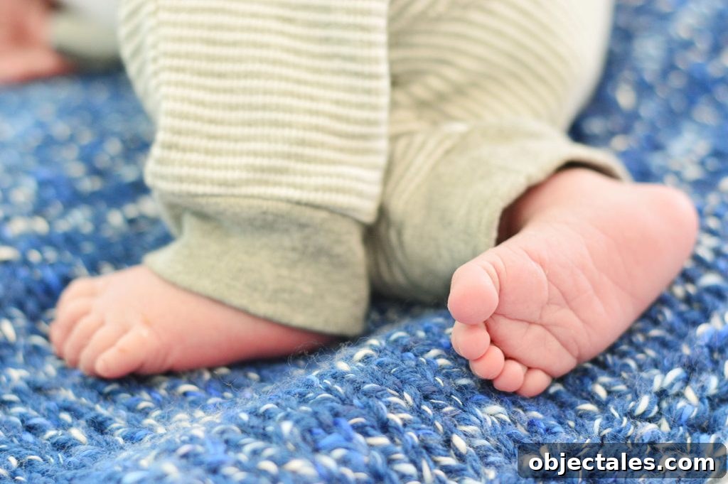 100 Timeless Boys' Names Parents Love 3 Small Newborn Baby Boy Feet On Blue Crochet Blanket