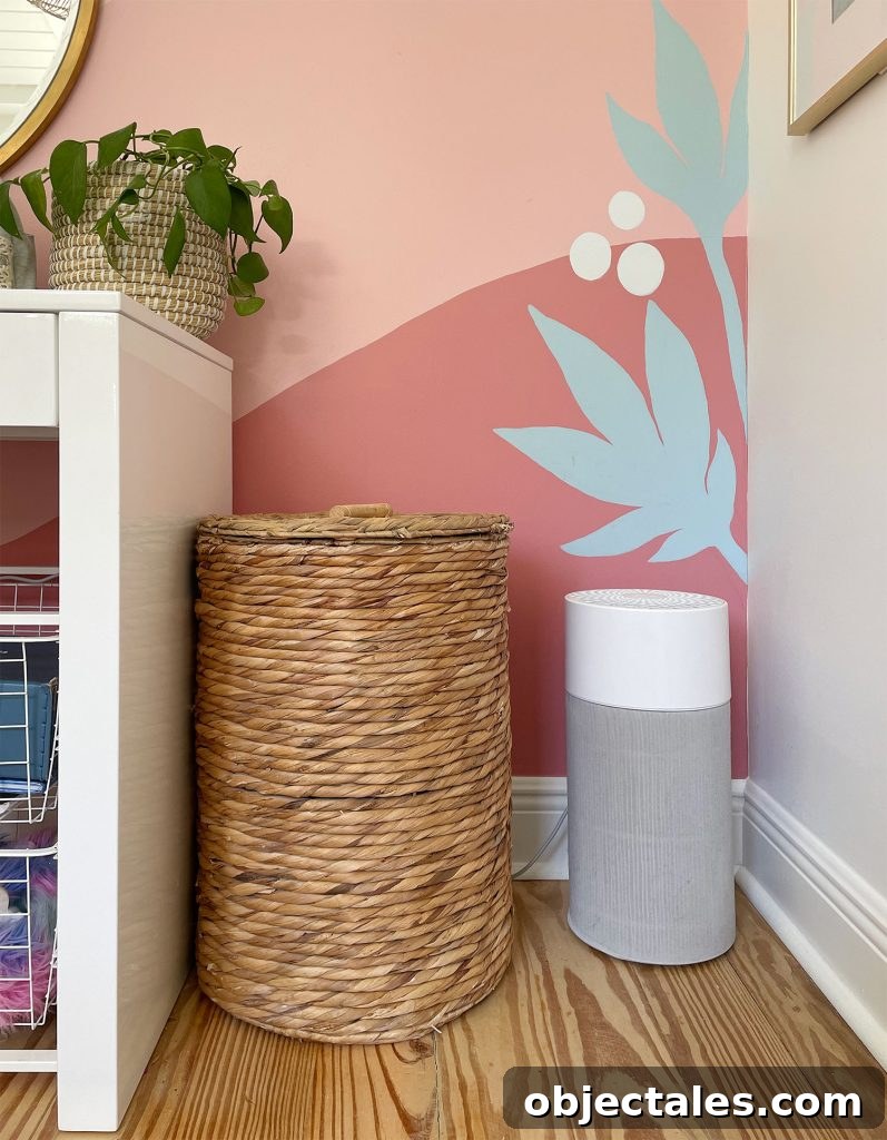 Smaller Blueair 411 Air Puriifer In Front Of Colorful Wall Mural