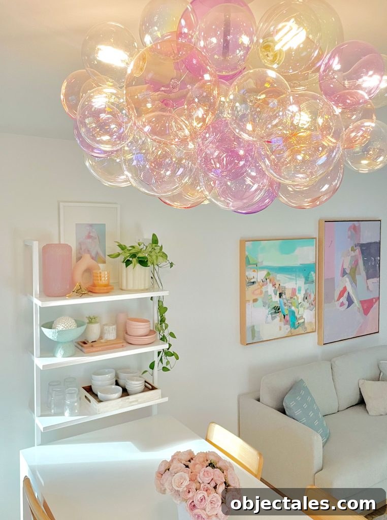Glass Bubble Light Fixture In Purple And Pink Above Kitchen Table
