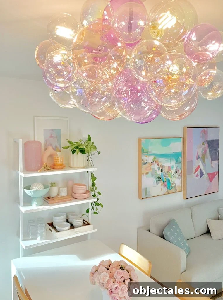 Glass Bubble Light Fixture In Purple And Pink Above Kitchen Table