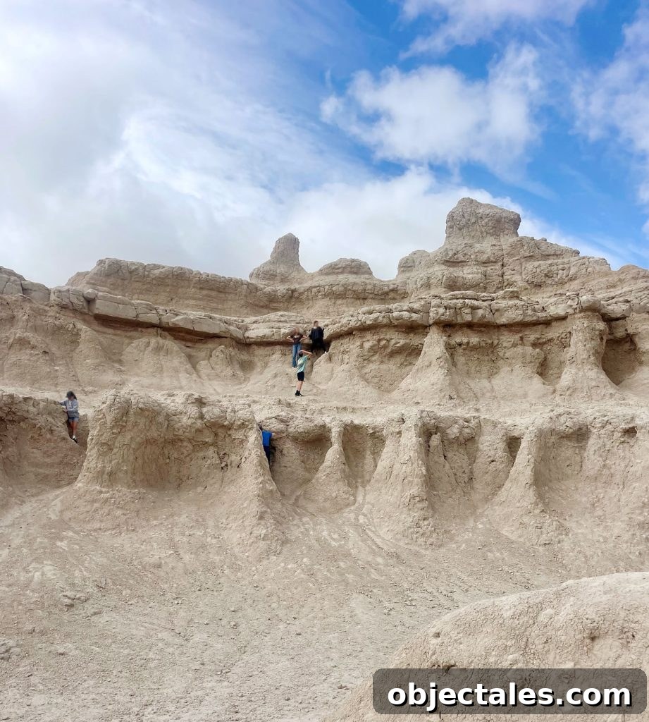 Kids Exploring Rock Formation In Badlands National Park