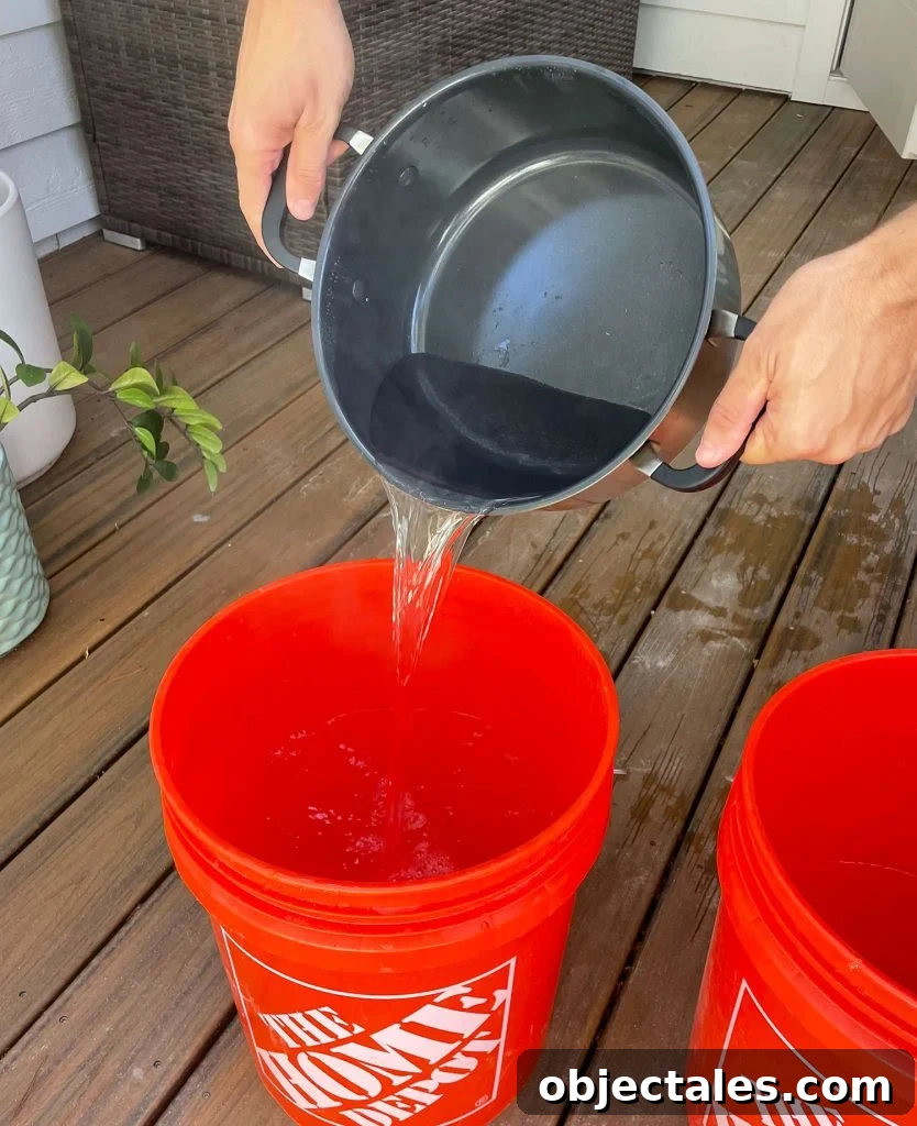 How to Dye Clothes at Home: Step-by-Step Tutorial 8 Pouring Boiling Water Into Bucket For Fabric Dye