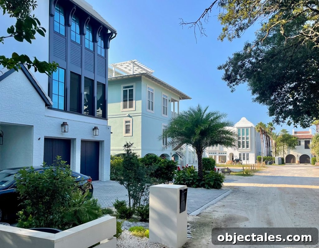 Multistory homes on street with palm trees