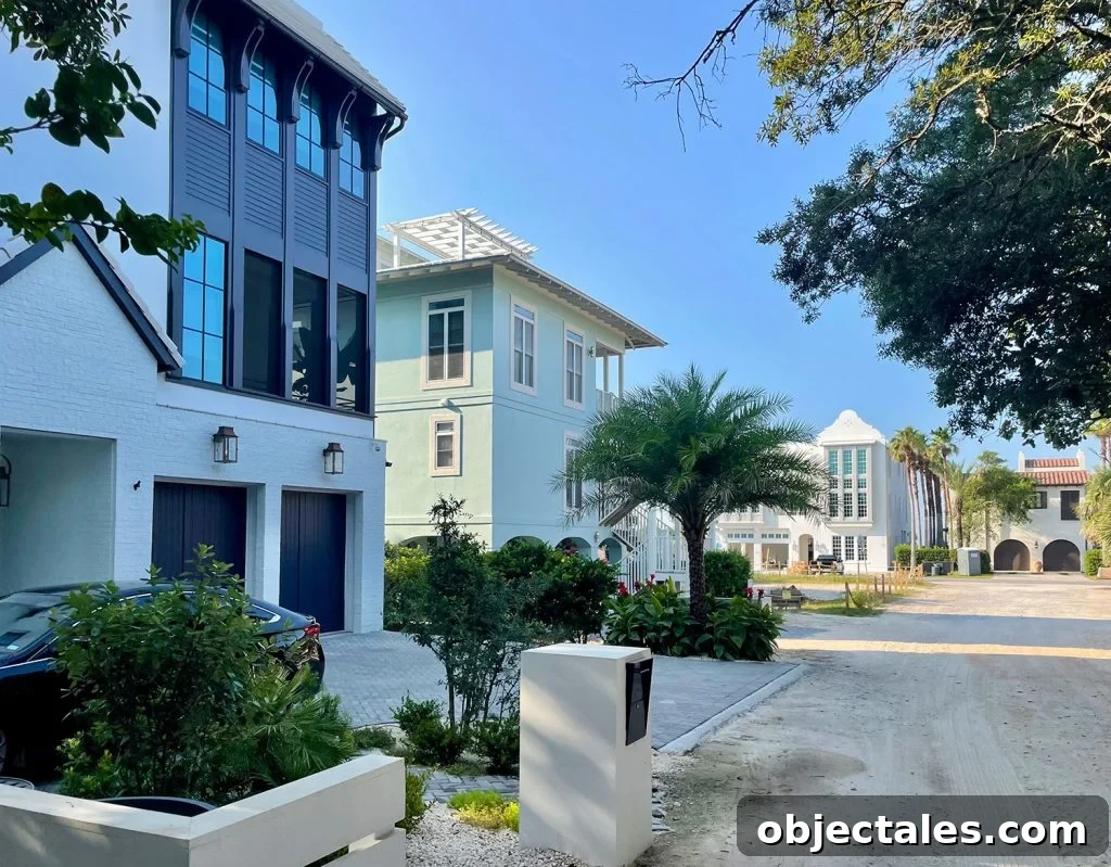 Multistory homes on street with palm trees