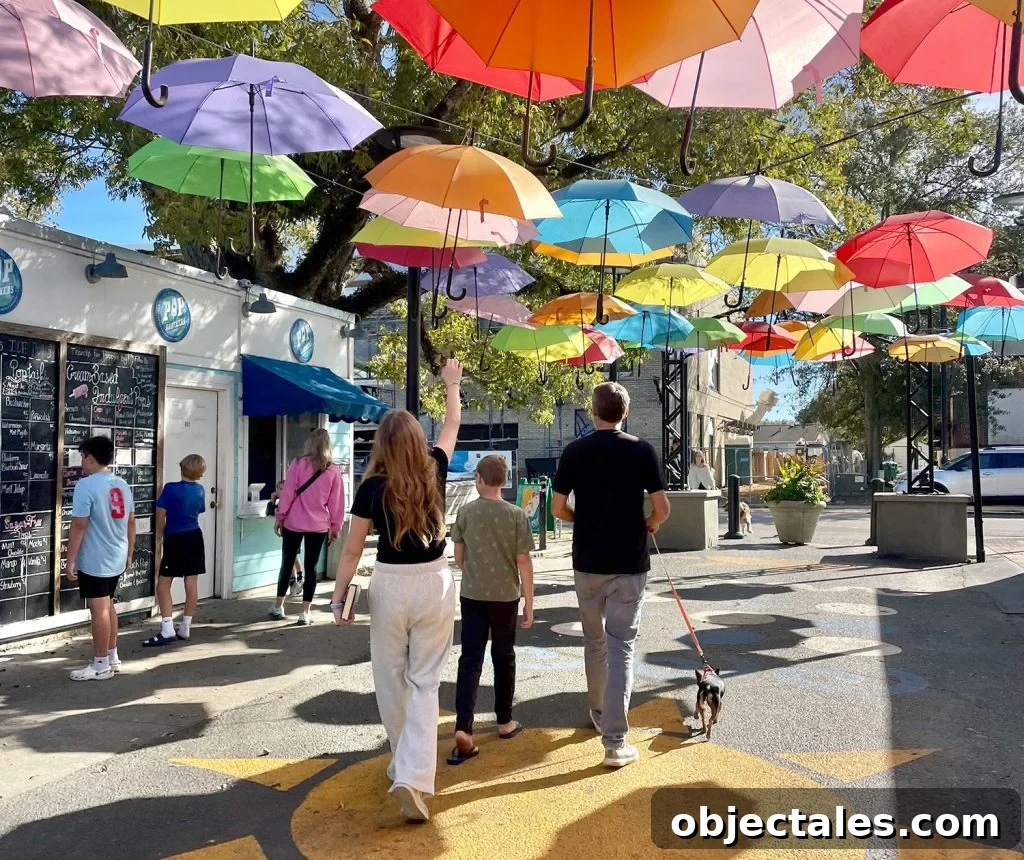 Weekend Escape in Ocean Springs: Beaches, Art and Dining 19 Kids Walking Under Bright Umbrellas In Cash Alley In Ocean Springs Mississippi