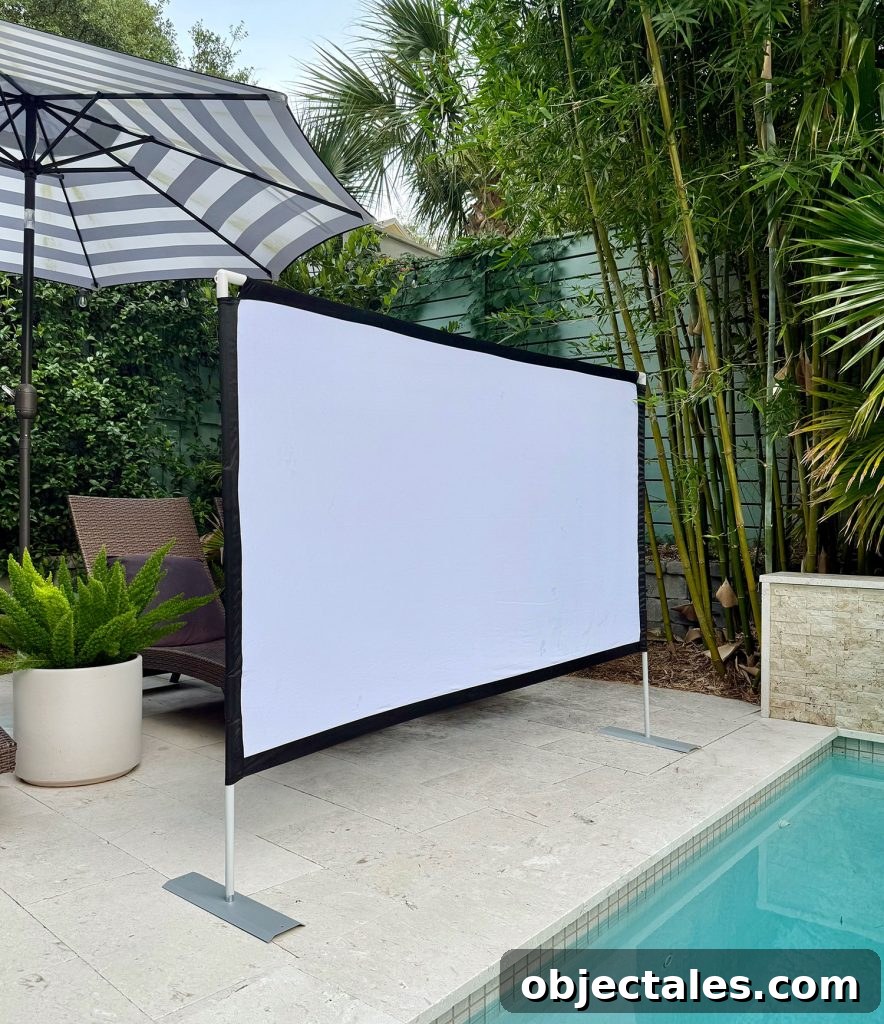 Host an Outdoor Movie Night: Gear Under $200 5 Collapsible Screen Set Up By Pool For Outdoor Movie Night