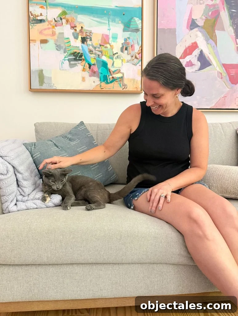 Sherry petting Jenny Cat On Couch Vertical Crop